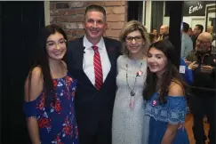  ?? Photo by Joseph B. Nadeau ?? Jon Brien poses for a photo with his family, from left, daughter Julianna, wife Nicole and daughter Gabriell, during a campaign announceme­nt event held at 285 Main St. on Thursday. Brien announced he is seeking election as Woonsocket’s next mayor.