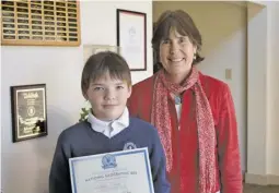  ?? BY LISA RAMEY ?? Caption: WCDS Geography Bee champion William Eborn with Mrs. Lindstrom, Head of School. Sixth-grader Eborn is competing against thousands of students in grades 4-8 across the United States for a chance to become the 2018 National Geographic Bee Champion.
