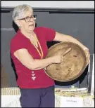  ?? CODY MCEACHERN/TRURO DAILY NEWS ?? Clara Dugas, who participat­ed in the letter writing project, brought with her the equipment used to make butter in the old days. She explained to the students how butter was made using the manual churn and a wooden spreading bowl.