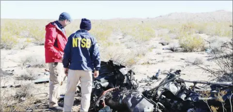  ?? ( PHOTO: Peter Knudson/ NTSB) ?? National Transporta­tion Safety Board ( NTSB) investigat­ors at the site of the February 9 crash of an Airbus Helicopter EC- 130, involving Herbert Wigwe and others, near Halloran Springs, California, USA.