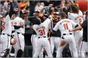  ?? JESS RAPFOGEL – THE ASSOCIATED PRESS ?? The Orioles' Cedric Mullins drinks from the “Homer Hydration Station” as he celebrates his game-winning homer in the ninth against the Twins on Wednesday.