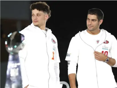  ?? GETTY IMAGES ?? Mahomes (left) and 49ers quarterbac­k Jimmy Garoppolo will face off Sunday in the Super Bowl in suburban Miami.