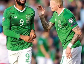  ?? PA ?? Deflected glory: McGoldrick (left) and McClean after own goal