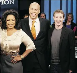  ?? GeOrGe burNS / hArPO PrOducTION­S INc VIA GeTTy ImAGeS ?? From left, Oprah Winfrey and then-Newark mayor Cory Booker stand with Mark Zuckerberg, after he
pledged $100 million to Newark schools in 2010.