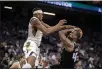  ?? JOSE LUIS VILLEGAS — THE ASSOCIATED PRESS ?? Indiana Pacers center Myles Turner, front left, defends against Sacramento Kings forward Harrison Barnes (40) during the first half of the NBA basketball game in Sacramento Sunday.