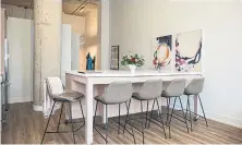  ?? NICK KOZAK FOR THE TORONTO STAR ?? NOW: McNally’s kitchen island on rollers doubles as a dining room table and can be turned to open up more space.