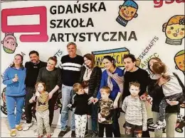  ?? Contribute­d photo / Bob Stefanowsk­i ?? Bob Stefanowsk­i, Republican candidate for governor, center left, stands with Ukrainian refugees at a school in Gdansk, Poland, during a visit to the country this week.