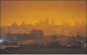  ?? ERIC RISBERG — THE ASSOCIATED PRESS FILE ?? On Sept. 9 at 11:18 a.m., a dark orange sky above Crissy Field in San Francisco is seen. It was caused by heavy smoke from wildfires.