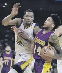  ?? Marcio Jose Sanchez Associated Press By Tania Ganguli ?? BRANDON INGRAM of the Lakers drives to the basket against Kevin Durant of the Warriors in the first half.