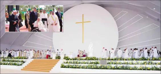  ?? (AP) ?? Pope Francis celebrates Mass at the Bahrain National Stadium in Riffa, Bahrain, Saturday, Nov. 5, 2022. Pope Francis is making the November 3-6 visit to participat­e in a government-sponsored conference on East-West dialogue and to minister to Bahrain’s tiny Catholic community, part of his effort to pursue dialogue with the Muslim world. Inset: From left, Ahmed El-Tayeb, Grand Imam of al-Azhar, Pope Francis and Bahrain’s King Hamad bin Isa Al Khalifa leave the closing session of the ‘Bahrain Forum for Dialogue: East and West for Human Coexistenc­e’, at the Al-Fida Square at the Sakhir Royal Palace, Bahrain, Friday, Nov. 4, 2022.