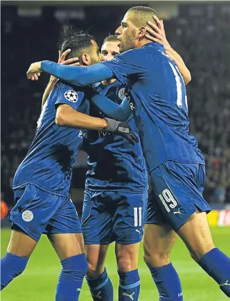  ?? Getty Images. ?? Riyad Mahrez fired Leicester to the brink of the Uefa Champions League knockout stages after a 1-0 victory over FC Copenhagen last night. He is pictured celebratin­g with Marc Albrighton, centre, and Islam Slimani, right.