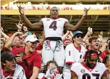  ?? CAITIE MCMEKIN / AP ?? Bulldogs wide receiver Mecole Hardman, celebratin­g the Sept. 30 rout of Tennessee with Georgia fans, has only seven catches for 58 yards and a touchdown this season.