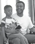  ?? ALEX HICKS JR./STAFF ?? Marquise Jackson, 27, and his son Nasir Jackson, 4, at the barbershop. Jackson talks about wanting to see Ja Morant in the NBA playoffs.