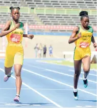 ?? PHOTO BY IAN ALLEN ?? St Mary High’s Glacian Loutin (left) winning the Class Three girls’ 200 metres ahead of teammate Sydonie McIntosh on yesterday’s final day of the Eastern Championsh­ips at the National Stadium.