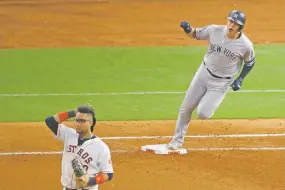  ?? SUE OGROCKI/ASSOCIATED PRESS ?? The Yankees’ Gio Urshela rounds first base after a home run as Astros first baseman Yuli Gurriel looks away Saturday in Game 1 of the AL Championsh­ip Series in Houston. Game 2 is Sunday in Houston.