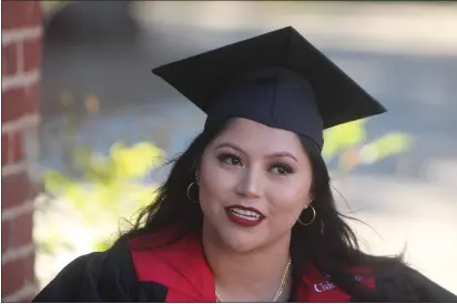  ?? PHOTOS BY RICK SILVA — PARADISE POST ?? Yureni Manzano became the first college graduate in her family when she graduated from California State University, Chico, on Friday.