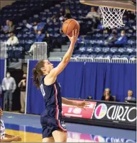  ?? John Peterson / Associated Press ?? Uconn’s Nika Muhl makes a layup against Creighton’s DeArica Pryor during a game on Thursday in Omaha, Neb.