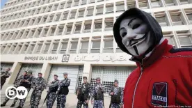  ??  ?? Protests in Lebanon are ongoing: A masked demonstrat­or outside Lebanon's central bank in Beirut