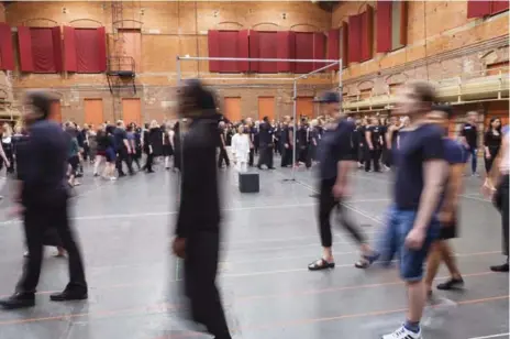  ?? GRANT STIRTON PHOTOS ?? Dancers walk in a circle around performer Denise Fujiwara during rehearsals for Apocalypsi­s. CBC Radio 2 is broadcasti­ng the show live on Sunday.