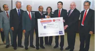  ??  ?? From left: Dean of Azman Hashim Internatio­nal Business School Prof Dr Wan Khairuzzam­an Wan Ismail, UTM chairman Tan Sri Abdul Halim Ali, Azman, Wahid, Noorul, Eqhwan, Payments Network Malaysia Group CEO Peter Schiesser and AmBank Group CEO Datuk...