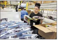  ?? Chicago Tribune/PHIL VELASQUEZ ?? A worker packs boxes at an Amazon fulfillmen­t center in Kenosha, Wis.