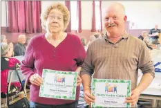  ?? CAROLE MORRIS-UNDERHILL ?? Marjorie Brightman and Benny Quinn show off one of the certificat­es they won for being top competitor­s at the 2018 Hants Senior Games.