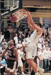  ?? Photo courtesy of Darcy Brown ?? TMU’s Tim Soares, right, scores against Westmont College at Master’s on Saturday night. Soares finished with a team-high 20 points and 12 rebounds.