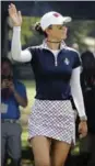  ?? CHARLIE RIEDEL, THE ASSOCIATED PRESS ?? American Michelle Wie waves to spectators in her singles match against Europe.