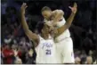  ?? MATT SLOCUM — THE ASSOCIATED PRESS ?? The 76ers’ Joel Embiid, left, and Justin Anderson celebrate after Embiid made a three-point basket during the second half of an NBA basketball game against the Brooklyn Nets, Friday in Philadelph­ia.