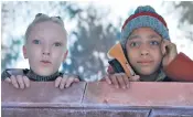  ?? ?? The alien and young boy in the official John Lewis advert, below, that features the song sung by Lola Young, inset; Lorraine and Jeremy Millington, right