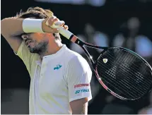  ?? KIRSTY WIGGLESWOR­TH/THE ASSOCIATED PRESS ?? Stan Wawrinka reacts Monday during a singles match against Daniil Medvedev on the opening day of Wimbledon in London.