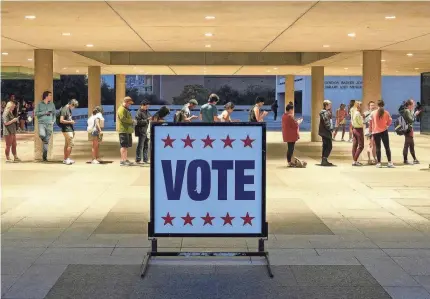  ?? JAY JANNER/USA TODAY NETWORK ?? Voters line up at the polls in Texas, which passed sweeping new election laws in 2021.