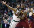  ?? MICHAEL DWYER — ASSOCIATED PRESS ?? LeBron James fights for position against Celtics forward Marcus Morris during the third quarter on May 13 in Boston.