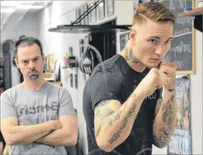  ?? T.J. COLELLO/CAPE BRETON POST ?? Ryan Rozicki of Sydney Forks shadow boxes in the mirror while under the watchful eye of coach Glen Williams on Thursday at Thunder Boxing in Sydney. Rozicki will fight Alvaro Enriquez of Mexico in a 190-pound bout at the Boxing Night in Canada fight...