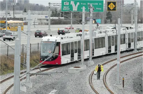  ?? JULIE OLIVER / POSTMEDIA NEWS FILES ?? The first Confederat­ion Line O-Train vehicle assembled in Ottawa. SNC-Lavalin says it will concentrat­e on bidding for infrastruc­ture projects in Canada as the federal government ramps up spending on sectors such as light rail.
