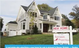  ?? — Reuters ?? A real estate sign advertisin­g a new home for sale is pictured in Vienna, Virginia.