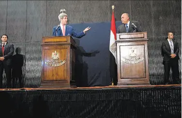  ?? Brendan Smialowski / Associated Press ?? Secretary of State John Kerry (left) joins Egyptian Foreign Minister Sameh Shukri at a Cairo conference.