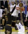  ?? ERIC RISBERG — THE ASSOCIATED PRESS ?? LeBron James blocks a shot by Andre Iguodala late in Game 7 of the 2016NBA Finals.