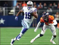  ?? Tribune News Service/getty images ?? Amari Cooper (19) of the Dallas Cowboys catches the ball in front of Pat Surtain II (2) of the Denver Broncos during the first quarter at AT&T Stadium on Nov. 7, 2021 in Arlington, Texas.