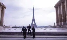  ??  ?? Police in front of the Eiffel Tower. Photograph: Barcroft Media via Getty Images