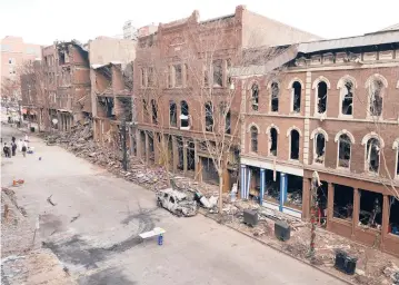  ?? MARK HUMPHREY/AP ?? Days after a Christmas Day bombing in downtown Nashville, Tennessee, debris remains in front of damaged buildings. An FBI investigat­ion has yet to call the explosion a terrorist act, leaving business owners in a tough spot.