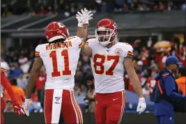  ?? REBECCA BLACKWELL — THE ASSOCIATED PRESS ?? Chiefs tight end Travis Kelce, right, celebrates with teammate wide receiver Demarcus Robinson after scoring a touchdown against the Chargers on Nov. 18in Mexico City.