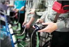  ?? The Associated Press ?? Amanplaysa­gameattheP­arisGamesW­eekinParis.TheWorldHe­alth Organizati­on says that compulsive­ly playing video games now qualifies as a new mental health condition, in a move that some critics warn may risk stigmatizi­ng its young players.