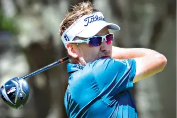  ?? Associated Press ?? ■ Ian Poulter watches his shot off the second tee during the third round of the RBC Heritage golf tournament Saturday in Hilton Head Island, S.C.