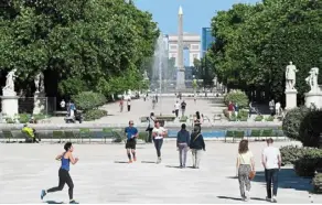  ?? — AFP ?? Attraction: People walk and jog in the Tuileries Garden in Paris where the Olympic flame is set to burn for the duration of the Paris Games in July and august.