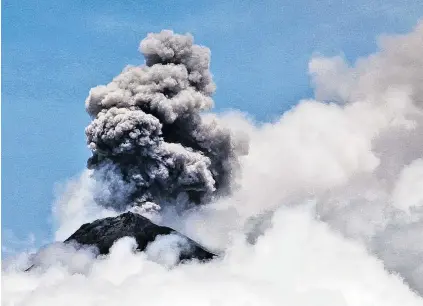  ?? PHOTO: SUSAN MCLAY ?? Ongoing eruptions . . . Clouds of smoke billow from Volcan de Fuego in Guatemala on Saturday. A major eruption took place on June 3 and a series of others have taken place since.