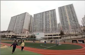  ?? (File Photo/AP/Ahn Young-joon) ?? Residents exercise Jan. 28, 2016, at a school near an apartment complex, the former location of the Brothers Home, in Busan, South Korea.