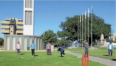  ??  ?? People from the English Learning Partners School have a go at a backyard cricket session as part of the new Kiwis Healthy Lifestyle Programme.