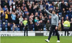  ?? Photograph: Kieran Cleeves/PA ?? John Mousinho waves to the fans at Fratton Park. He took them to eighth in 2023 and they are now on the verge of promotion.