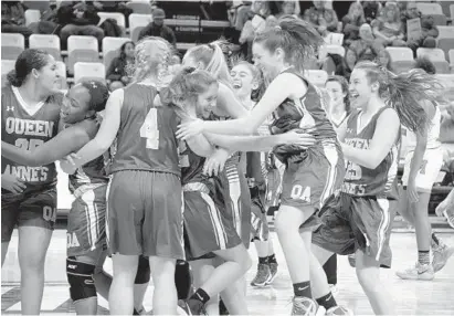  ?? KARL MERTON FERRON/BALTIMORE SUN ?? Queen Anne's players elebrate their victory over Oakland Mills in their first trip to the Class 2A state semifinals. The Lions will play Poolesvill­e, which defeated Gwynn Park in the other semifinal, today for the state championsh­ip at Towson’s SECU...